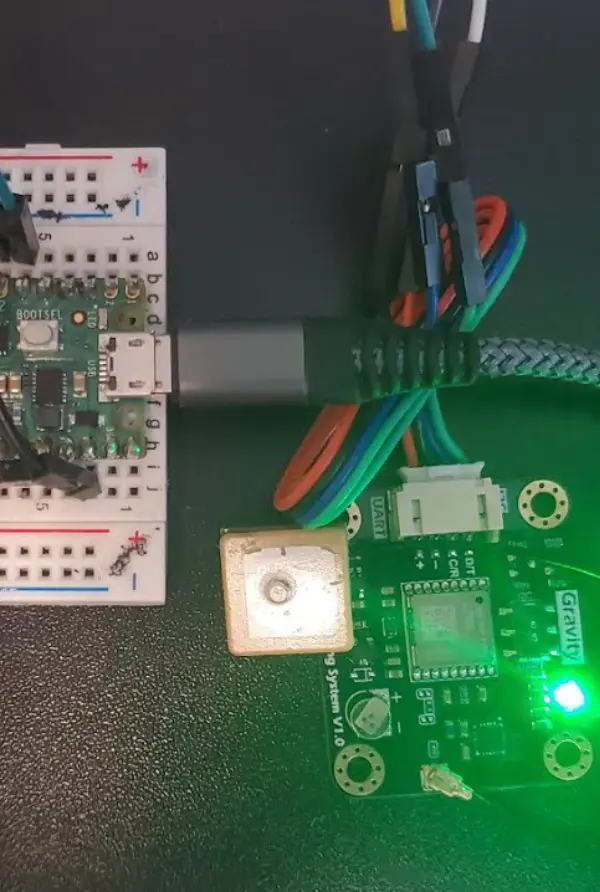 A close-up of the HelmHUD electronics prototype and connected circuit board.